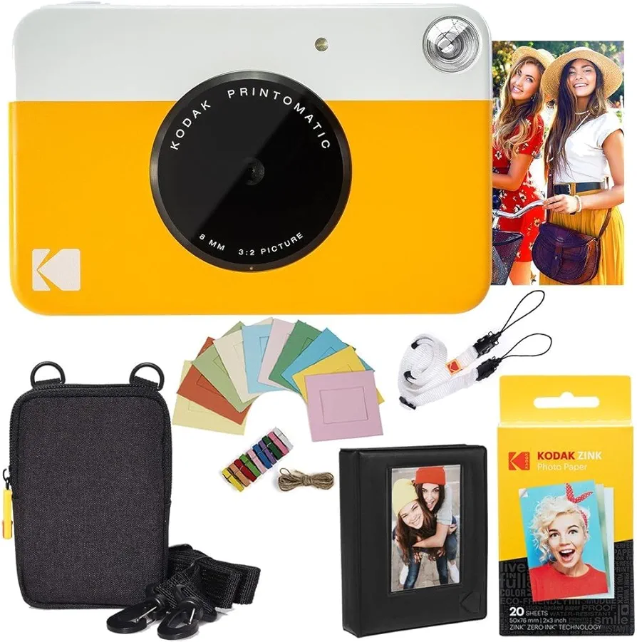 KODAK: Paquete cámara instantánea Printomatic (Amarilla) + Papel Zink (20 Hojas) + Funda álbum de Fotos + Marcos para Colgar + cómoda